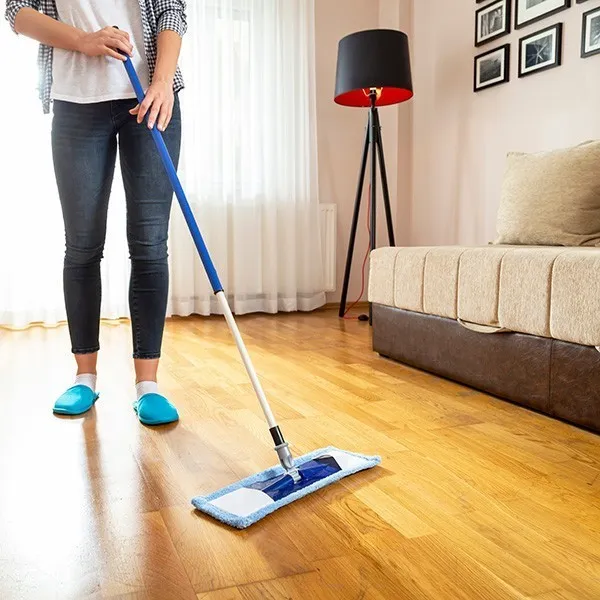 Woman cleaning floor | Taylor Floor Covering