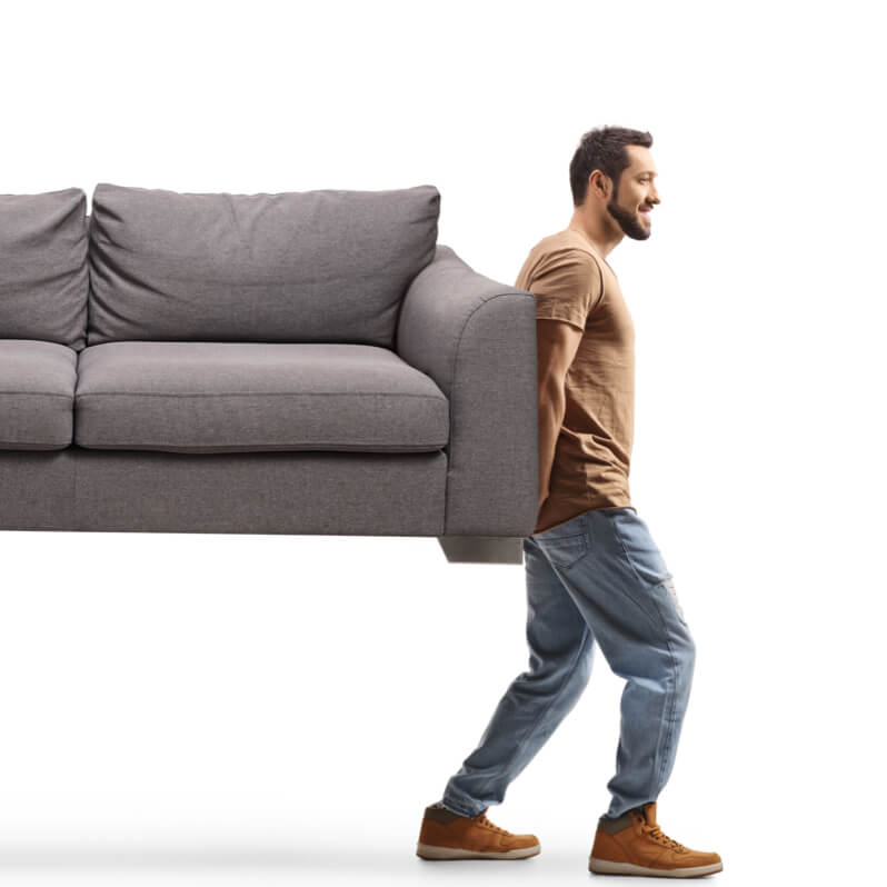 Man moving sofa | Taylor Floor Covering