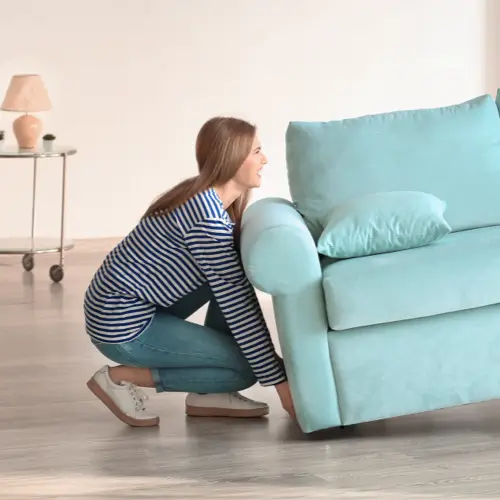 Woman moving sofa | Taylor Floor Covering