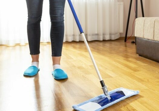 Woman cleaning floor | Taylor Floor Covering